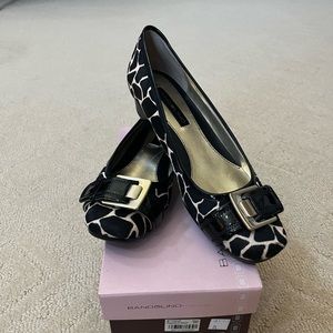 Slightly, heeled cheetah print flats
